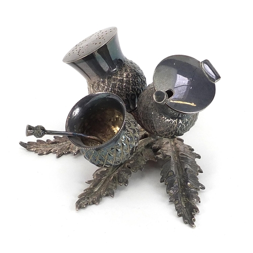 2261 - Victorian silver plated cruet set in the form of a thistle, with two spoons, 13cm wide