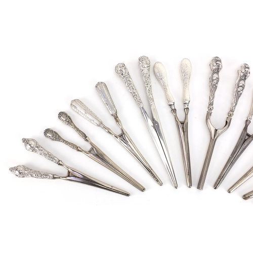 2256 - Ten pairs of Victorian and later silver handled glove stretchers including one pair all silver, vari... 