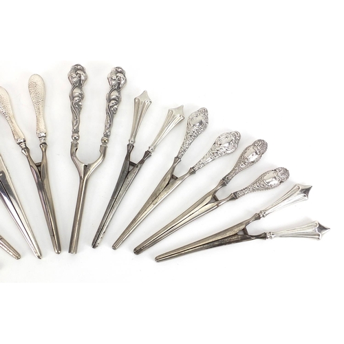 2256 - Ten pairs of Victorian and later silver handled glove stretchers including one pair all silver, vari... 