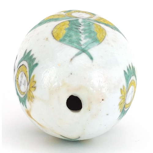 143 - Turkish Kutahya Armenian pottery hanging ball hand painted with faces, 10cm high