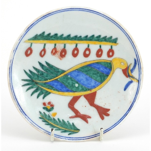 139 - Turkish Kutahya pottery plate hand painted with a bird, 14.5cm in diameter