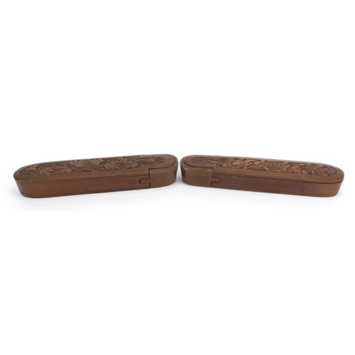 200 - Pair of Islamic wooden pen boxes carved with leaves and flowers, each 24.5cm in length