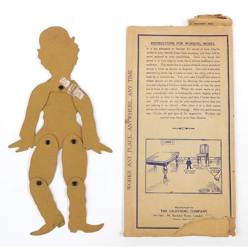 1347 - The Amazing Dancing Charlie Chaplin Illusion dancing figure with box, 35.5cm wide