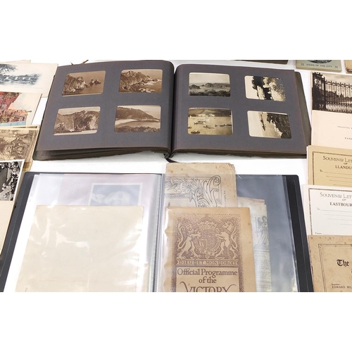 1085 - Victorian and later ephemera including black and white photographs arranged in albums and postcards