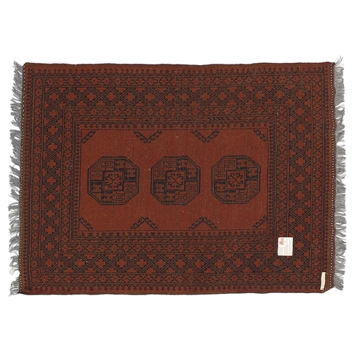 865 - Middle Eastern rectangular brown ground rug having an all over geometric design, Knecht A G label to... 