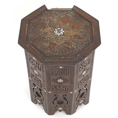 793 - Manner of Liberty & Co octagonal Moorish style  occasional table with mother of pearl inlay, carved ... 