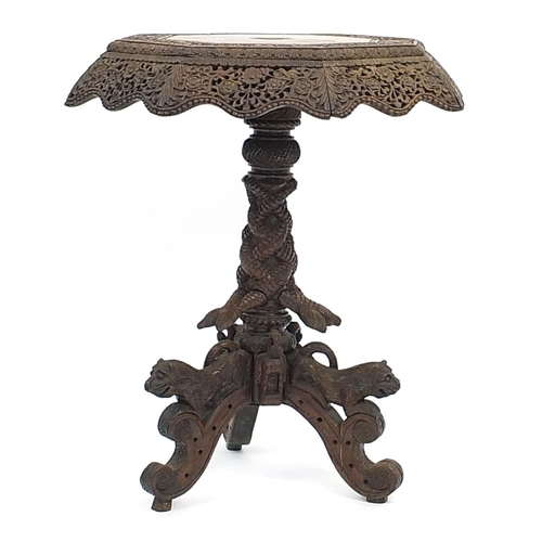 800 - Burmese side table with octagonal top profusely carved with wild animals amongst flowers, with serpe... 