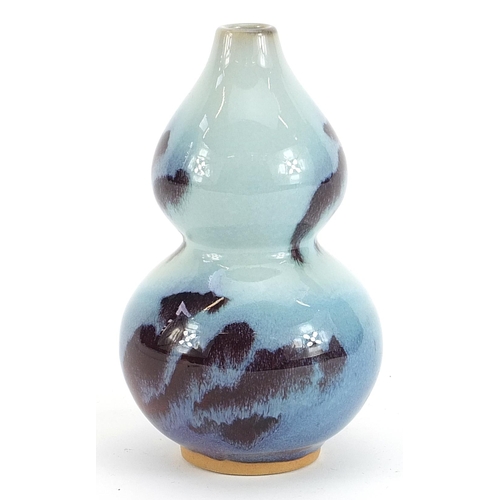 739 - Chinese double gourd porcelain vase having a flambe glaze, 16cm high