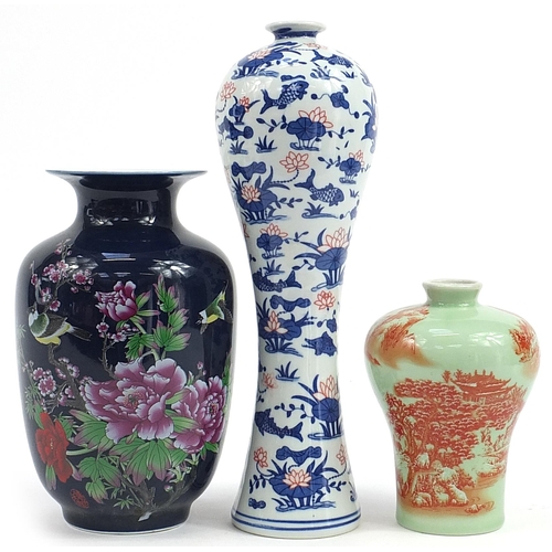 727 - Three Chinese porcelain vases including a blue ground example decorated with a bird amongst flowers,... 