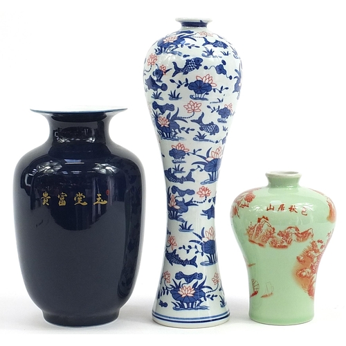 727 - Three Chinese porcelain vases including a blue ground example decorated with a bird amongst flowers,... 