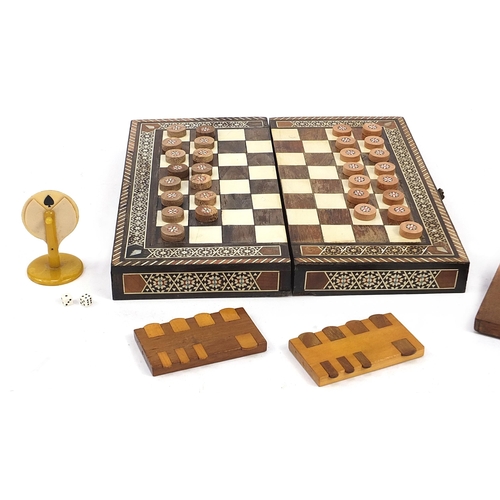 1376A - 19th century and later game accessories including folding chessboard, Moorish style folding games bo... 