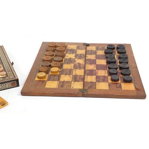 1376A - 19th century and later game accessories including folding chessboard, Moorish style folding games bo... 