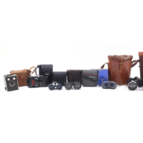 1220 - Cameras, binoculars and accessories including World War II Binoprism No 5 with leather case and Niko... 