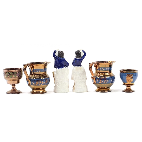 953 - Victorian pottery including lustre jugs and two Staffordshire figures, the largest 20cm high