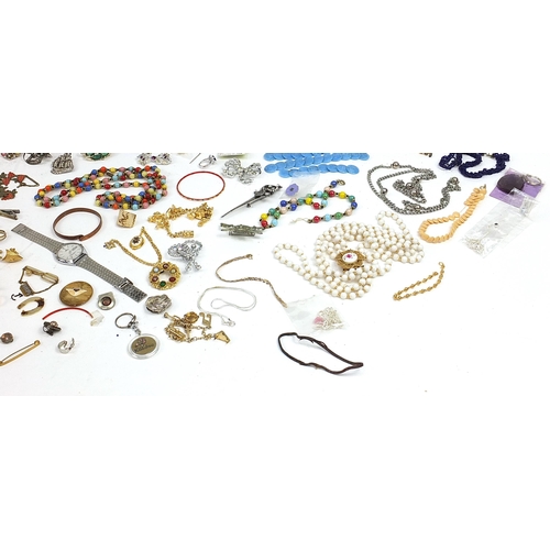 911 - Vintage and later costume jewellery including brooches, simulated pearls, necklaces and a Lorus gent... 