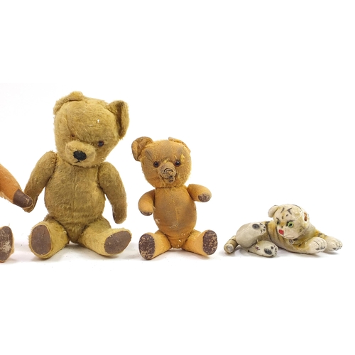 1353 - Four antique golden teddy bears with jointed limbs and a tiger, possibly Steiff, the largest 41cm hi... 