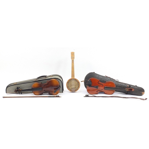 1215 - Two old wooden violins with bows and fitted cases and a Marseille banjolele