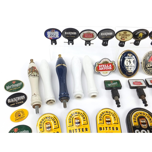 691 - Collection of advertising bar beer pumps and beer pump labels including Stella, Kronenbourg, Bass an... 