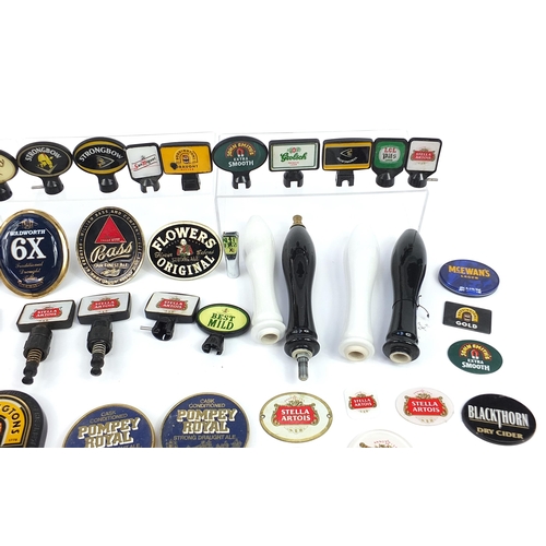 691 - Collection of advertising bar beer pumps and beer pump labels including Stella, Kronenbourg, Bass an... 