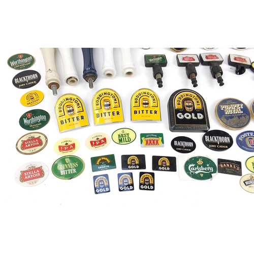 691 - Collection of advertising bar beer pumps and beer pump labels including Stella, Kronenbourg, Bass an... 