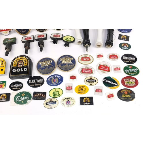 691 - Collection of advertising bar beer pumps and beer pump labels including Stella, Kronenbourg, Bass an... 