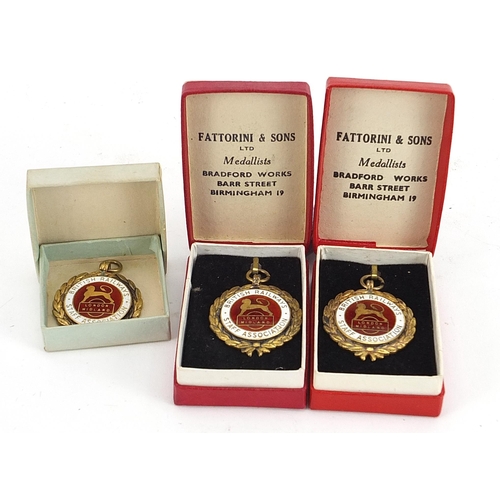 1486 - Three British Railways Staff Association silver gilt and enamel jewels, total 47g