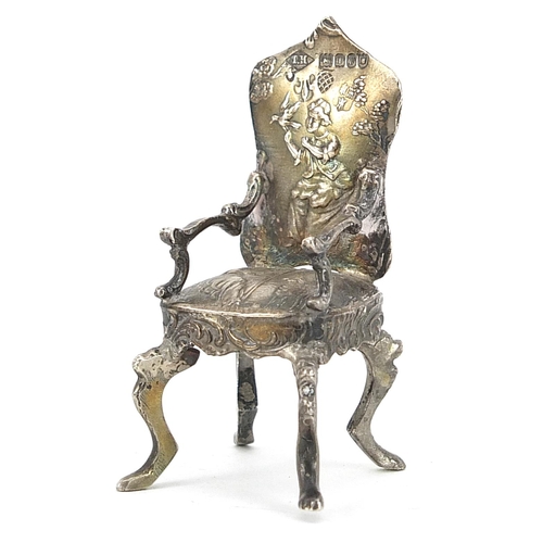 2268 - Theodore Hartmann, Edwardian silver doll's house chair embossed with a shepherd with sheep and a gir... 