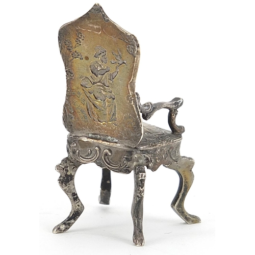 2268 - Theodore Hartmann, Edwardian silver doll's house chair embossed with a shepherd with sheep and a gir... 