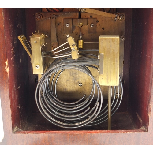 298 - Antique mahogany mantle clock with Westminster chime striking on five gongs, and silvered dial, the ... 