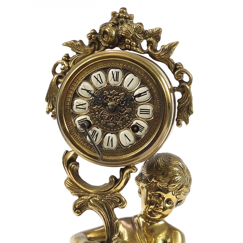 1267 - Large ornate brass mantle clock in the form of a semi nude boy holding an acanthus leaf, the dial ha... 