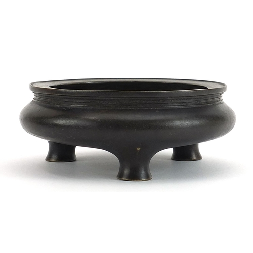 287 - Chinese patinated bronze tripod incense burner, character marks to the base, 12.5cm in diameter