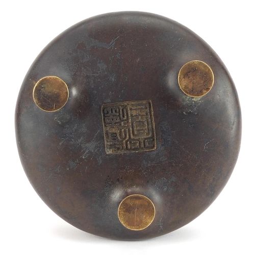 287 - Chinese patinated bronze tripod incense burner, character marks to the base, 12.5cm in diameter