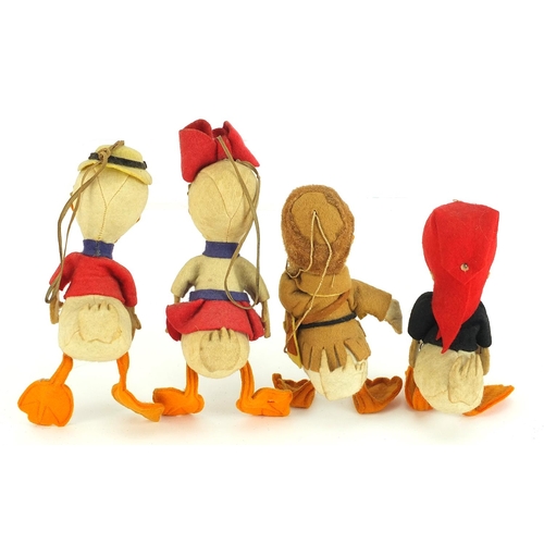 1351 - Four vintage Disney style duck toys, the largest 16cm high