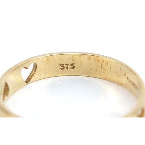 1943 - Two 9ct gold rings, one set with a diamond, the other pierced with love hearts, sizes I and L, 2.8g