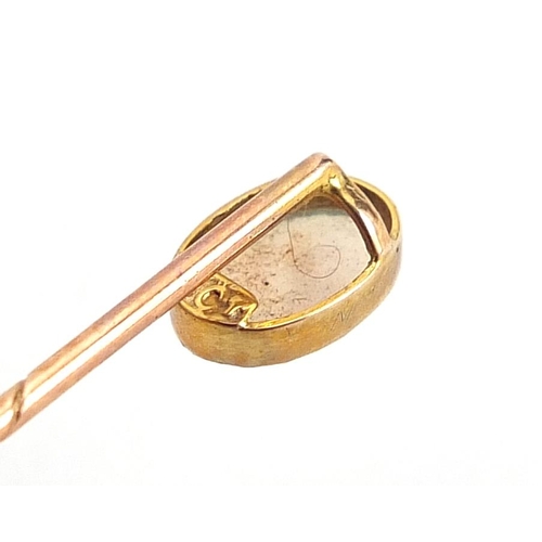 1975 - Two gold stickpins comprising one 9ct gold set with a cabochon opal and one unmarked gold set with a... 