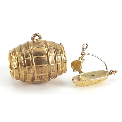 1689 - Two 9ct gold charms comprising beer barrel and sailing boat, the largest 1.6cm wide, total 2.3g