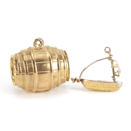 1689 - Two 9ct gold charms comprising beer barrel and sailing boat, the largest 1.6cm wide, total 2.3g