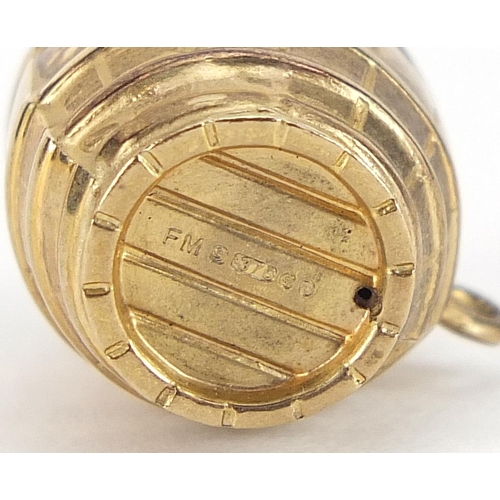 1689 - Two 9ct gold charms comprising beer barrel and sailing boat, the largest 1.6cm wide, total 2.3g