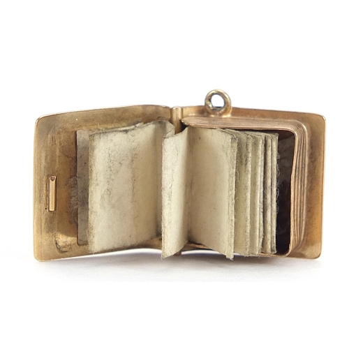 2003 - 9ct gold holy bible charm opening to reveal folding pages, 1.4cm high, 2.2g