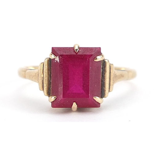 1722 - 9ct gold pink stone ring with stepped shoulders, (tests as ruby) size Q, 3.3g