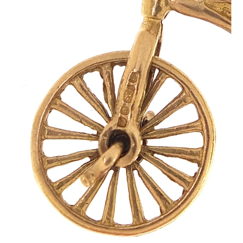 1701 - 9ct gold penny farthing charm, 2.5cm in length, 2.3g