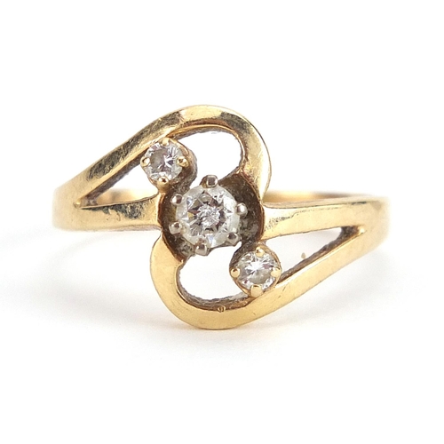 1886 - 14ct gold diamond three stone crossover ring, size R, 3.7g