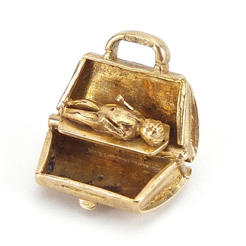 1899 - Marston Barrett, 9ct gold doctor's bag charm opening to reveal a baby inside, 1.6cm wide, 5.3g