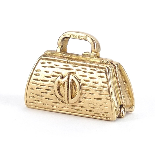 1899 - Marston Barrett, 9ct gold doctor's bag charm opening to reveal a baby inside, 1.6cm wide, 5.3g