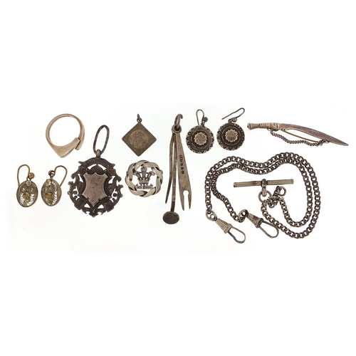 2025 - Silver and white metal jewellery including a watch chain with T bar, sports jewel and Gurkha's kukri... 