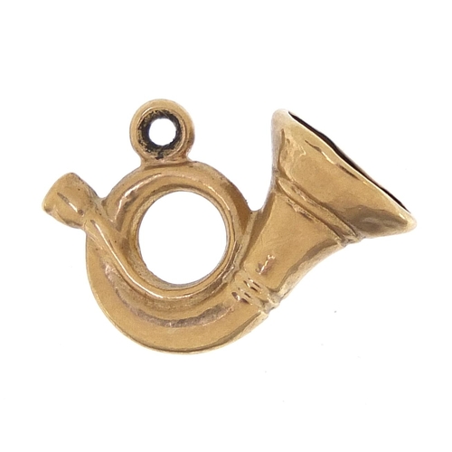 2037 - 9ct gold French horn charm, 1.5cm in length, 0.4g