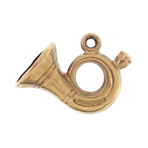 2037 - 9ct gold French horn charm, 1.5cm in length, 0.4g