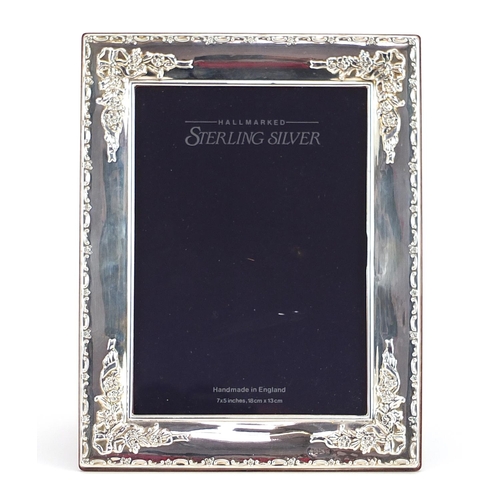 2233 - Carrs, rectangular silver easel photo frame embossed with flowers and foliage, Sheffield 1994, 22.5c... 