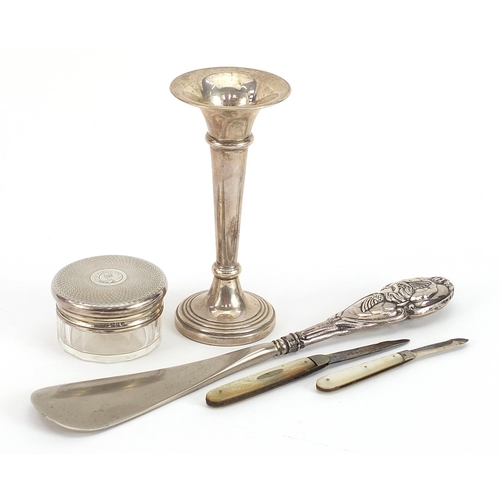 2260 - Silver objects including trumpet shaped bud vase, two mother of pearl flanked folding fruit knives a... 