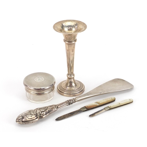 2260 - Silver objects including trumpet shaped bud vase, two mother of pearl flanked folding fruit knives a... 